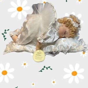 Emerald Brand “Ashley” Sleeping Angel Porcelain Doll/White Floral Dress. NWT⬇️